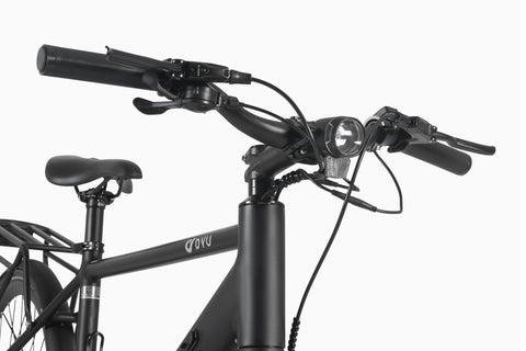 Close-up of DYU Stroll 1 electric bike handlebars with controls and front light. Close-up of DYU Stroll 1 electric bike handlebars with controls and front light.