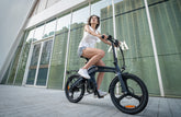 a woman is riding DYU T1 20 Inch Foldable Electric Bike