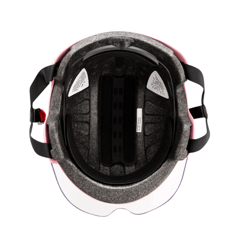 Interior view of a pink DYU bike helmet with padding and ventilation slots for comfort. Interior view of a pink DYU bike helmet with padding and ventilation slots for comfort.