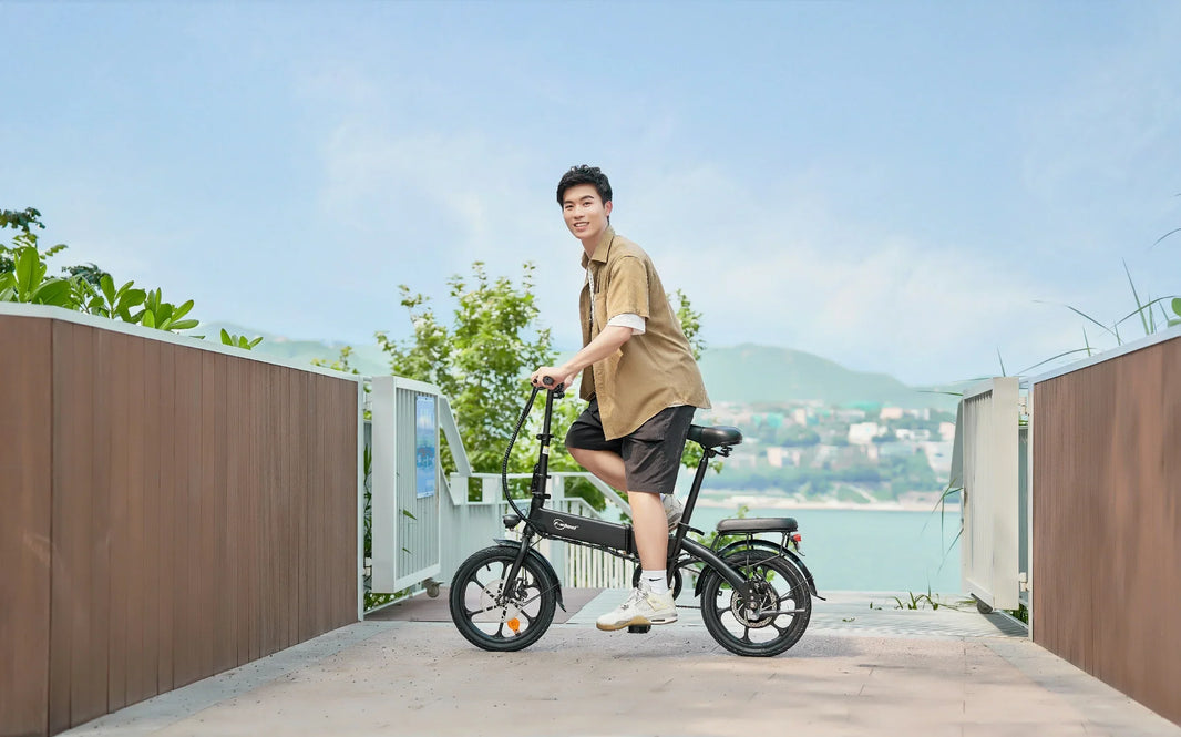 DYU A1F Pro folding e-bike rider on terrace with ocean view for UK seaside wind guide