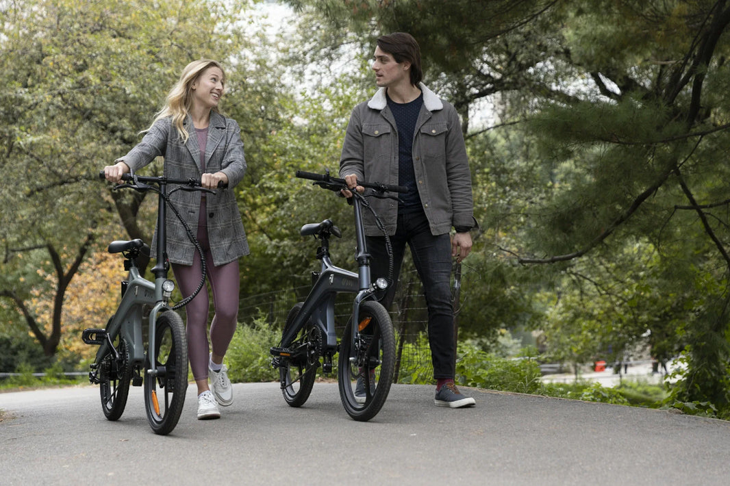 DYU T1 folding e-bikes on a park path for the UK Summer Sale
