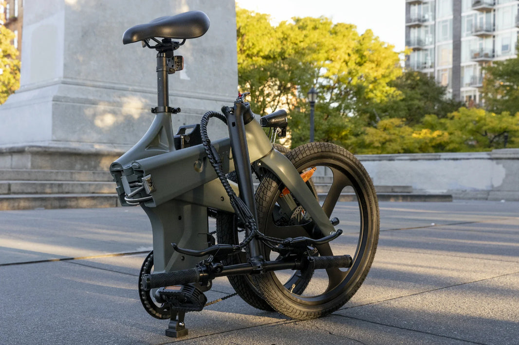 DYU T1 folding e-bike parked in an urban plaza